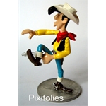 Pixi MORRIS : Lucky Luke Lucky Luke tirant par dessous sa jambe droite Pixi MORRIS : Lucky Luke Lucky Luke tirant par dessous sa jambe droite