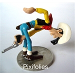 Pixi MORRIS : Lucky Luke Lucky Luke tirant entre ses jambes Pixi MORRIS : Lucky Luke Lucky Luke tirant entre ses jambes