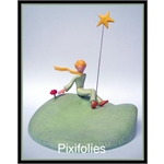 Pixi ST EXUPERY : Le Petit Prince Le Petit Prince assis à côté de sa fleur
