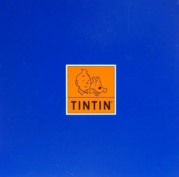Tintin tenant les albums (1)